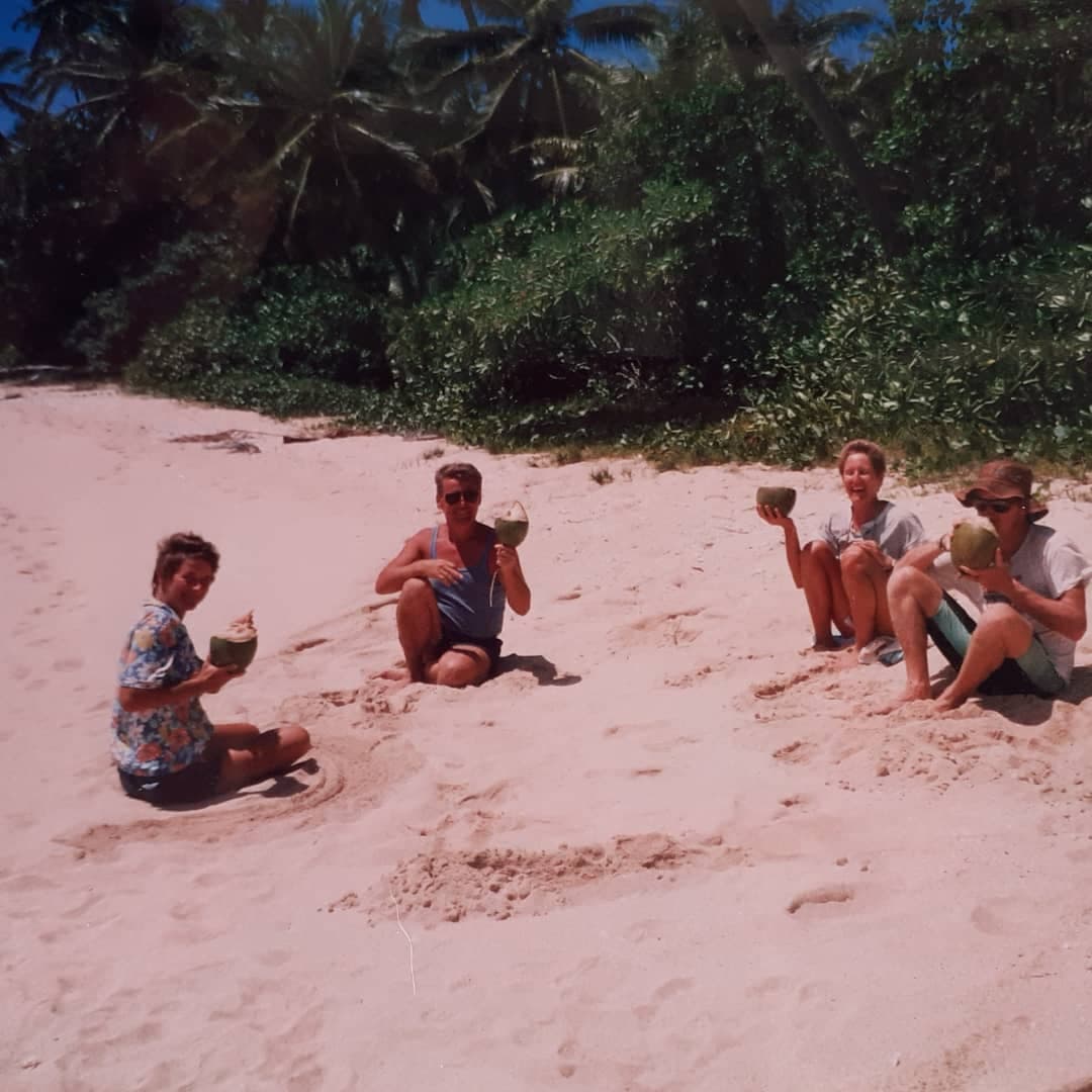 /18b Tonga fiji Margie and friends drinking cocnuts on beach.jpg